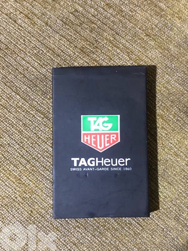 A genuine Swiss-made Tag Heuer phone that works well but need charger 8