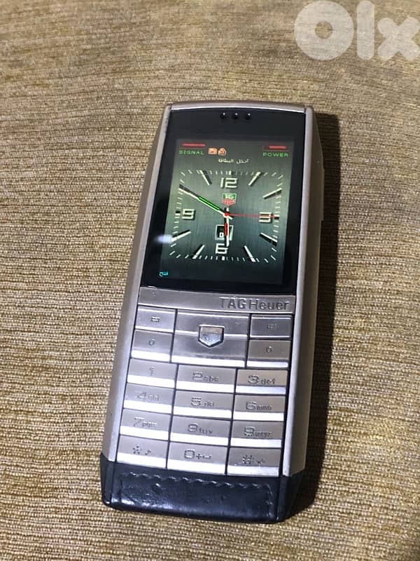 A genuine Swiss-made Tag Heuer phone that works well but need charger 10