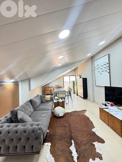 A furnished rooftop apartment with terrace in Awkar.