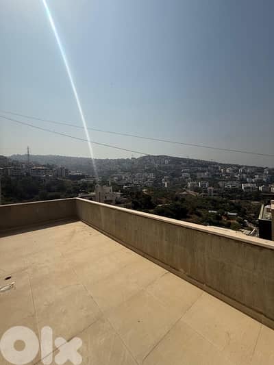 A furnished rooftop apartment with terrace in Awkar.