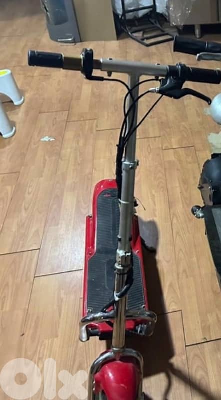 red used electric scooter 0