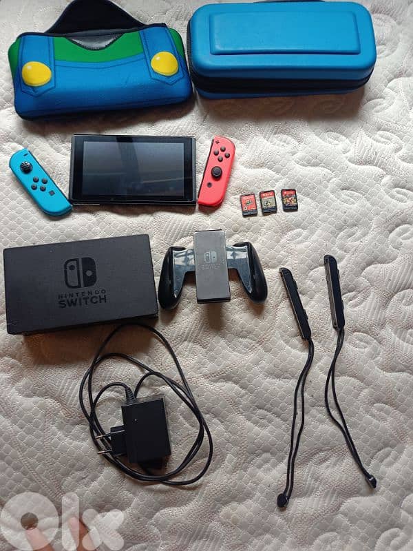 Urgently selling Nintendo Switch + 3 Games + Accessories (64GB SD) 0