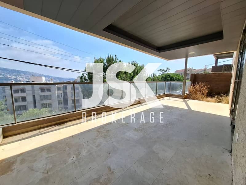 L18611 - Spacious Apartment with Garden For Rent in Jeita 0