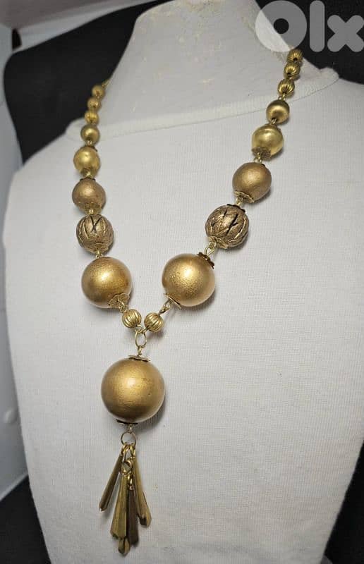 10$ gold-tone statement necklace with brass bead 1