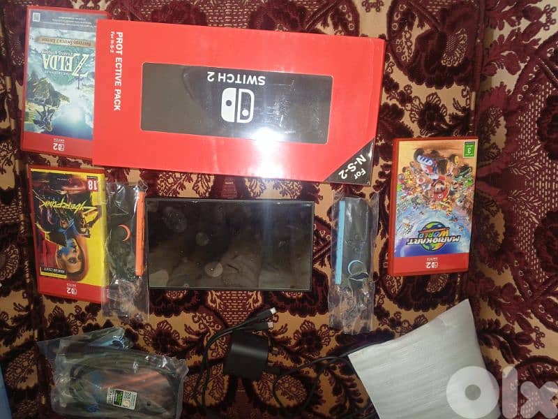 switch 2 like new with 2 games online subscription 1 year Zelda not included or trade with ps5 slim or fat 2