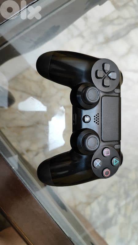 Used PS4 with 2 controllers and a bunch of cd games 5