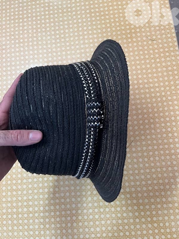 black braided cloche-style woman’s hat 0