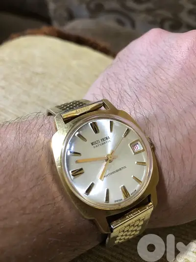 MULTI PRIMA DATOMATIC MANUAL ANTIMAGNETIC SWISS MADE 1970  ساعة ربط