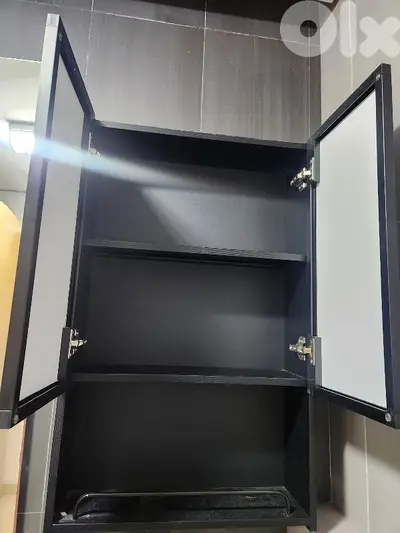 bathroom storage box with a black mirror door.