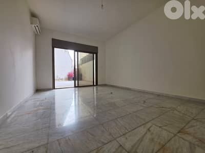 L20974 - Spacious Apartment With Backyard Terrace For Sale in Hazmieh