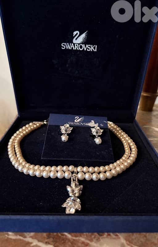 Swarovski faux pearl necklace and ear rings set. 1