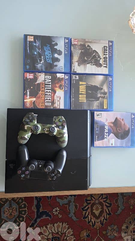 used ps4 for sale with 2 original controllers with 5 games 0