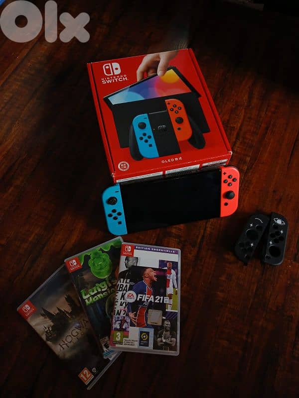 Nintendo switch oled with 3 video games plus all accessories 0