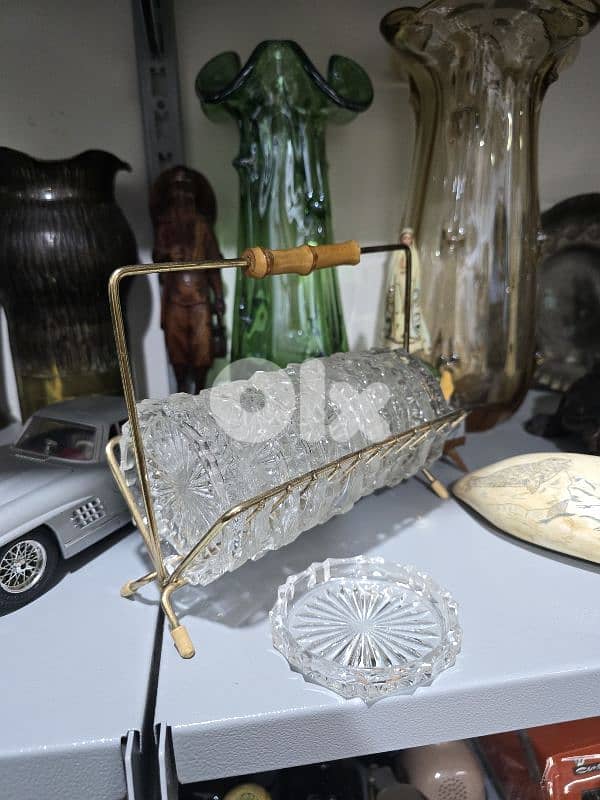 vintage crystal coasters in a brass rack 0