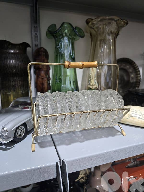vintage crystal coasters in a brass rack 1
