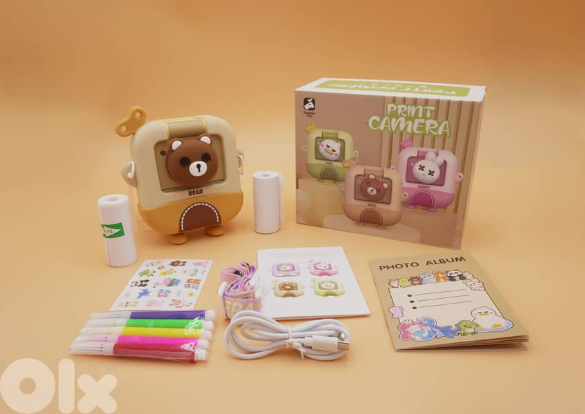 brown printing instant camera 0