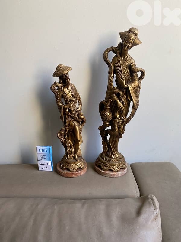 Two resin old statues . 51 cm. 41 cm. 0