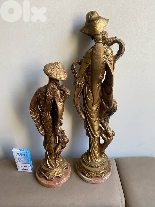 Two resin old statues . 51 cm. 41 cm. 3