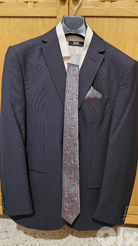 Italian  suit with a shirt and tie 0
