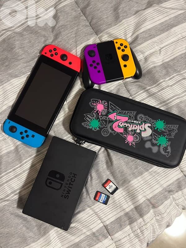 Nintendo Switch with 4 controllers, case, docking station and 2 games 0