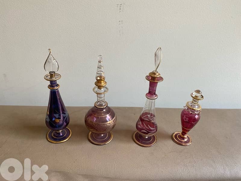 four miniature perfume bottles 0