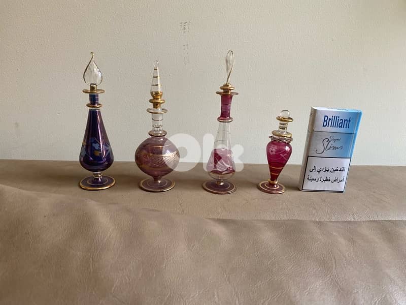 four miniature perfume bottles 1