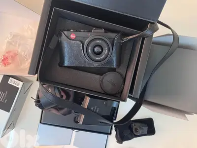 Leica X2 + Olympus EVF VF2  + Leica leather case + filter holder in pe