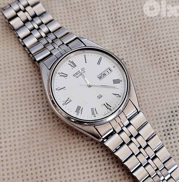 Vintage Seiko SQ Quartz white Roman Dial Day-Date Watch 0