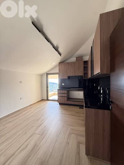High end rooftop apartment for sale in Baabdat W/ open mountain views