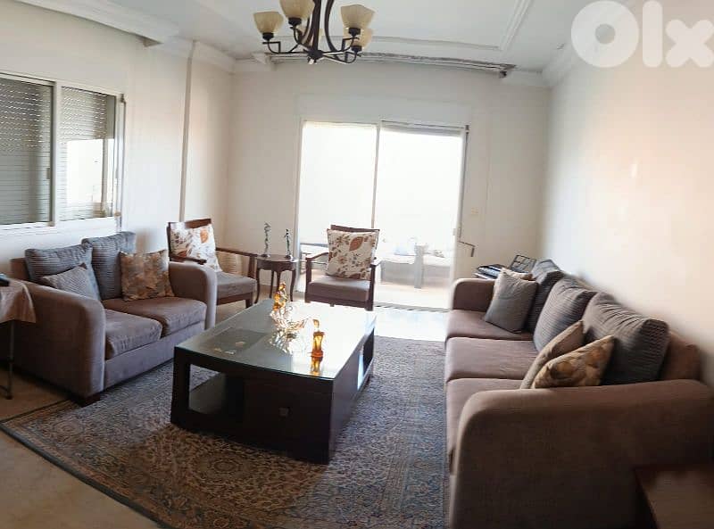 Living room sofas, tables, carpet and chadelier 0