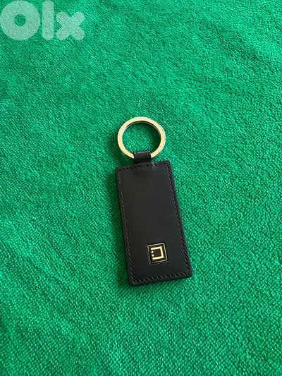 Original S. T. Dupont genuine leather keychain.