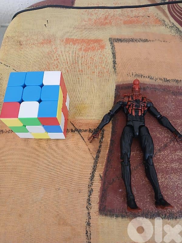 Rubix cube and Spiderman action figure 0