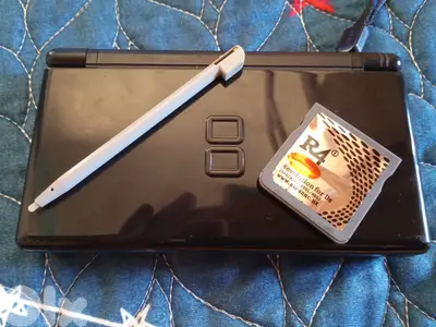 Used black ds lite(but in good condition) either 4 card if u whant