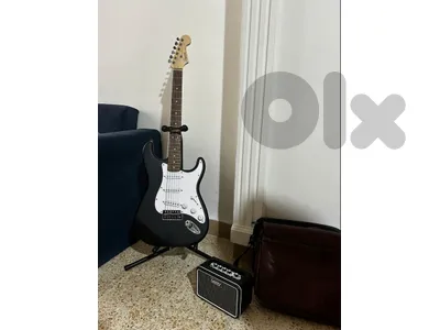 electric guitar + amplifier