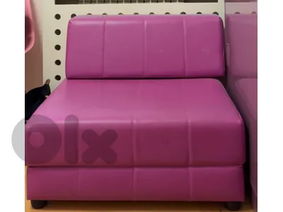 fushia couch opens and can be used as a bed. free gift poof with ir