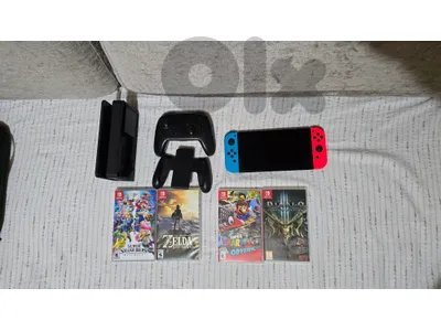 Nintendo Switch OLED + 4 games + Switch Pro Controller