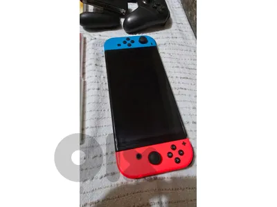 Nintendo Switch OLED + 4 games + Switch Pro Controller