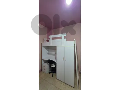 bed with closet and desk