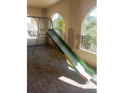 ترامبولين و زحليطه و مرجوحة
