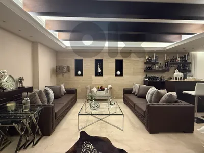 2 brown leather sofas + grey chair