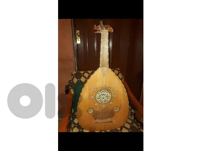 عود محمد خليفة مُطَعَم إحترافي صناعة ٢٠٠٩ صوت رنان قوي ورخيم خشب ورد وجوز  (تليفون:٠٣/٤٤٧٦٢٦)