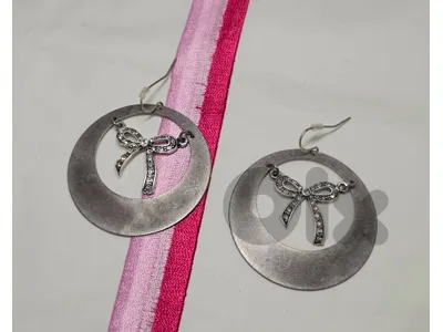 5$ silver tone dangle bow charm earrings