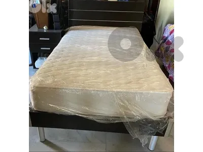 Bed with matress and side table