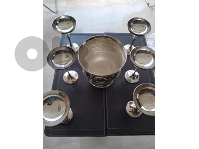 Silver plated champagne glasses with ice bucket