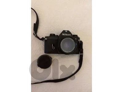 Vintage Nikon EM 35mm Film SLR Camera with Nikon Series E Lens
