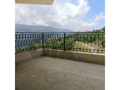 Spacious apartment for sale in Ajaltoun with open greenery views.