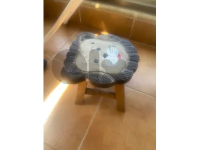 Wooden lion shaped stool