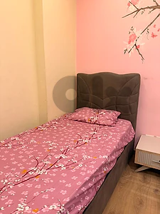 2 beds and a closet with a small drawer
