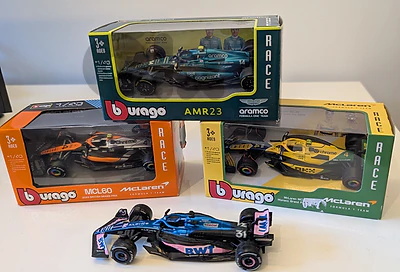 Bburago 1:43 Formula 1 diecast: McLaren (Norris), Aston Martin (Alonso), Alpine (Gasly)