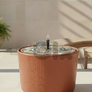 concrete fountain basin with mosaic table